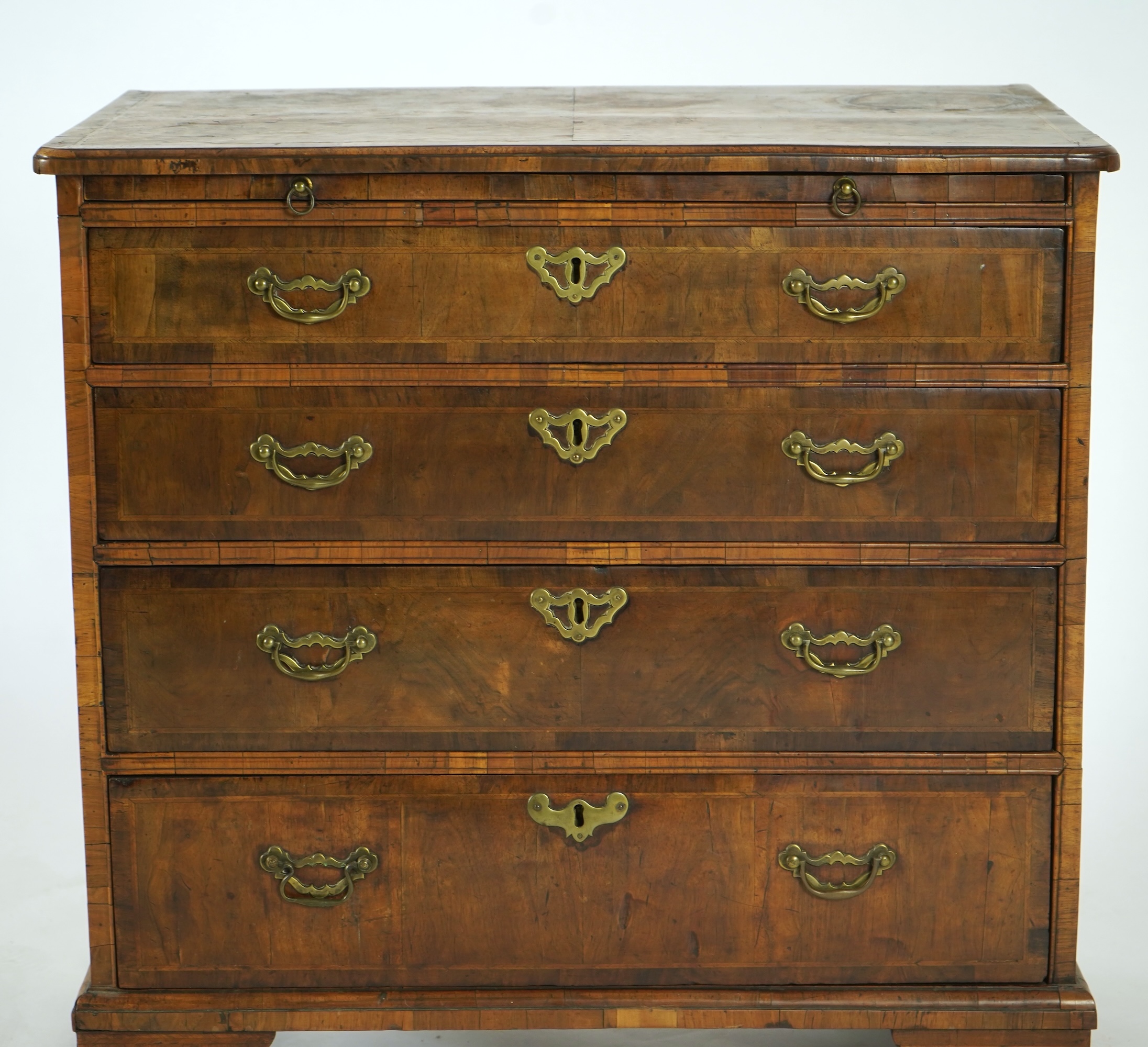 A small George I feather banded walnut chest